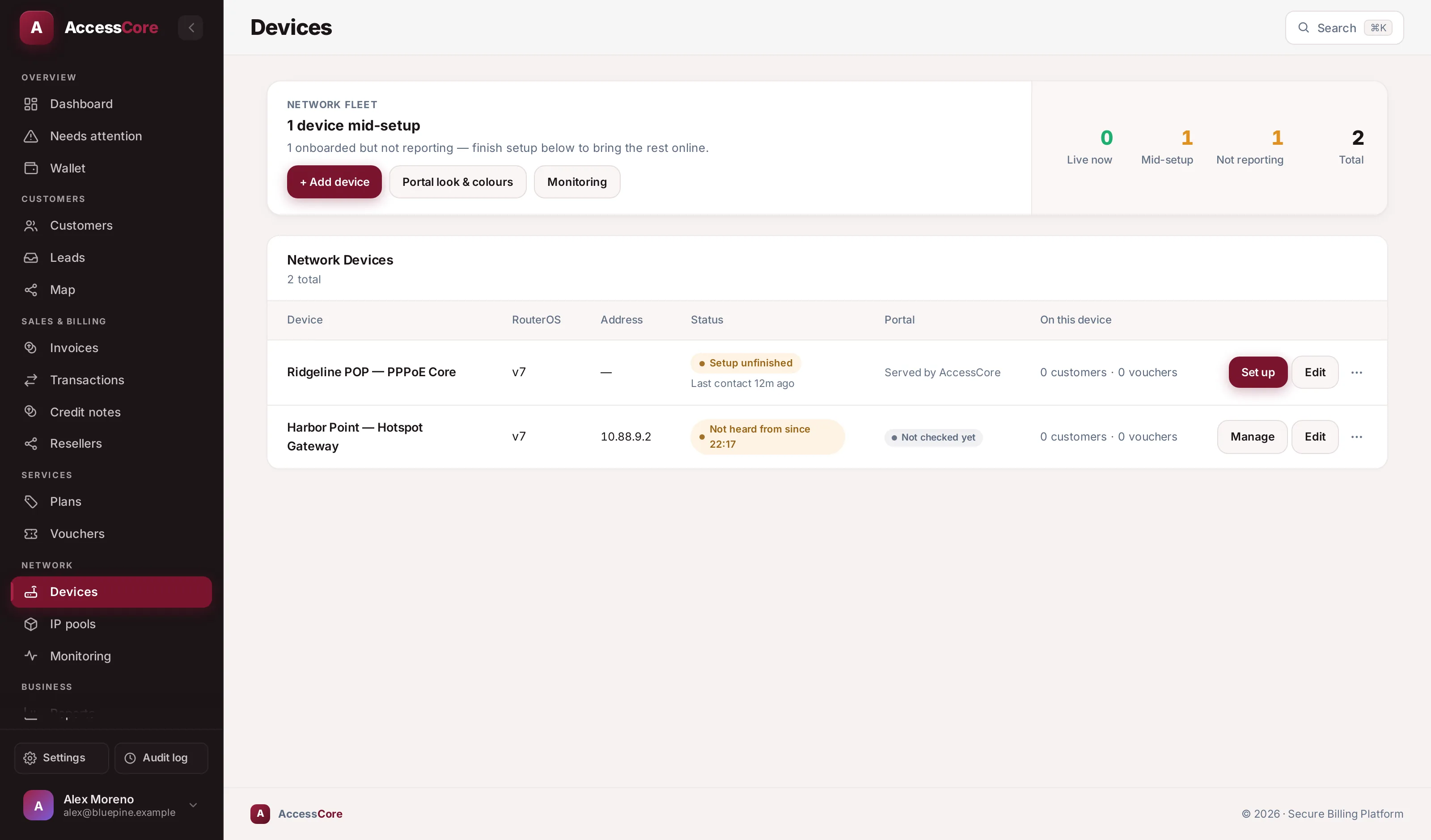 The Devices fleet in AccessCore — two MikroTik routers, both online, accounting flowing